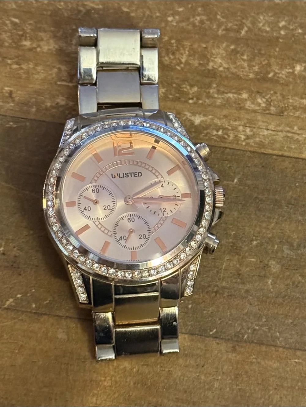 Unlisted by Kenneth Cole gold stainless steel crystal bezel watch